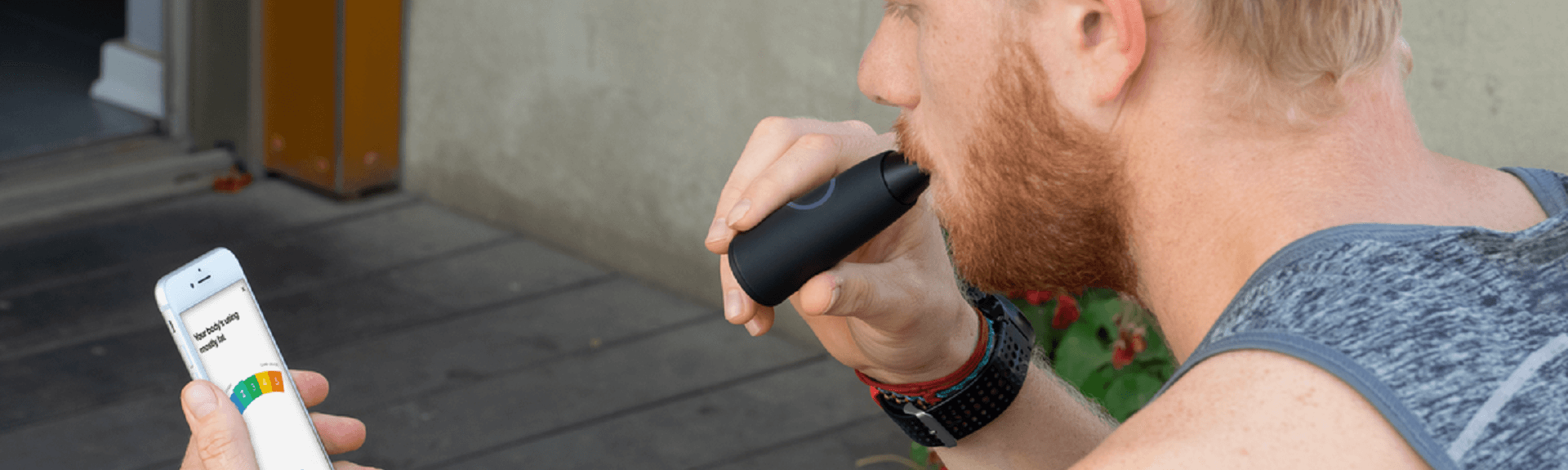 A man is using Lumen's device and looking at his application